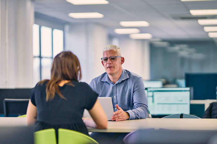 Two colleagues talking