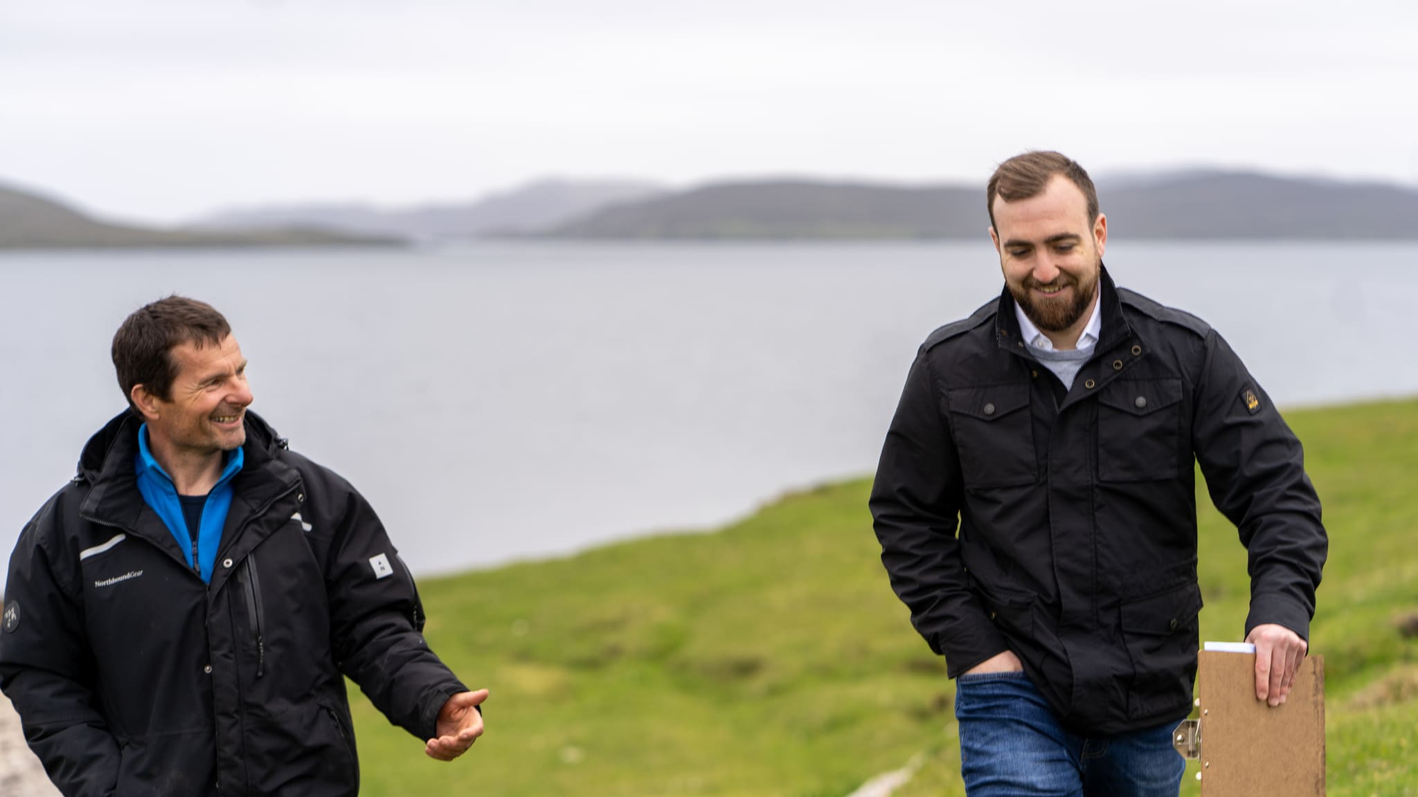 Two men walking and talking