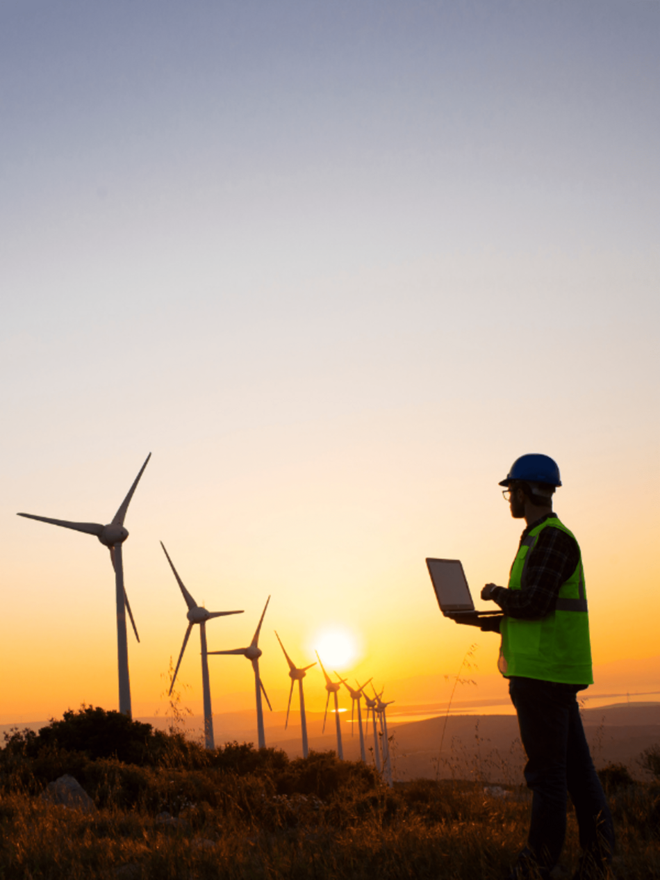 man and wind turbines